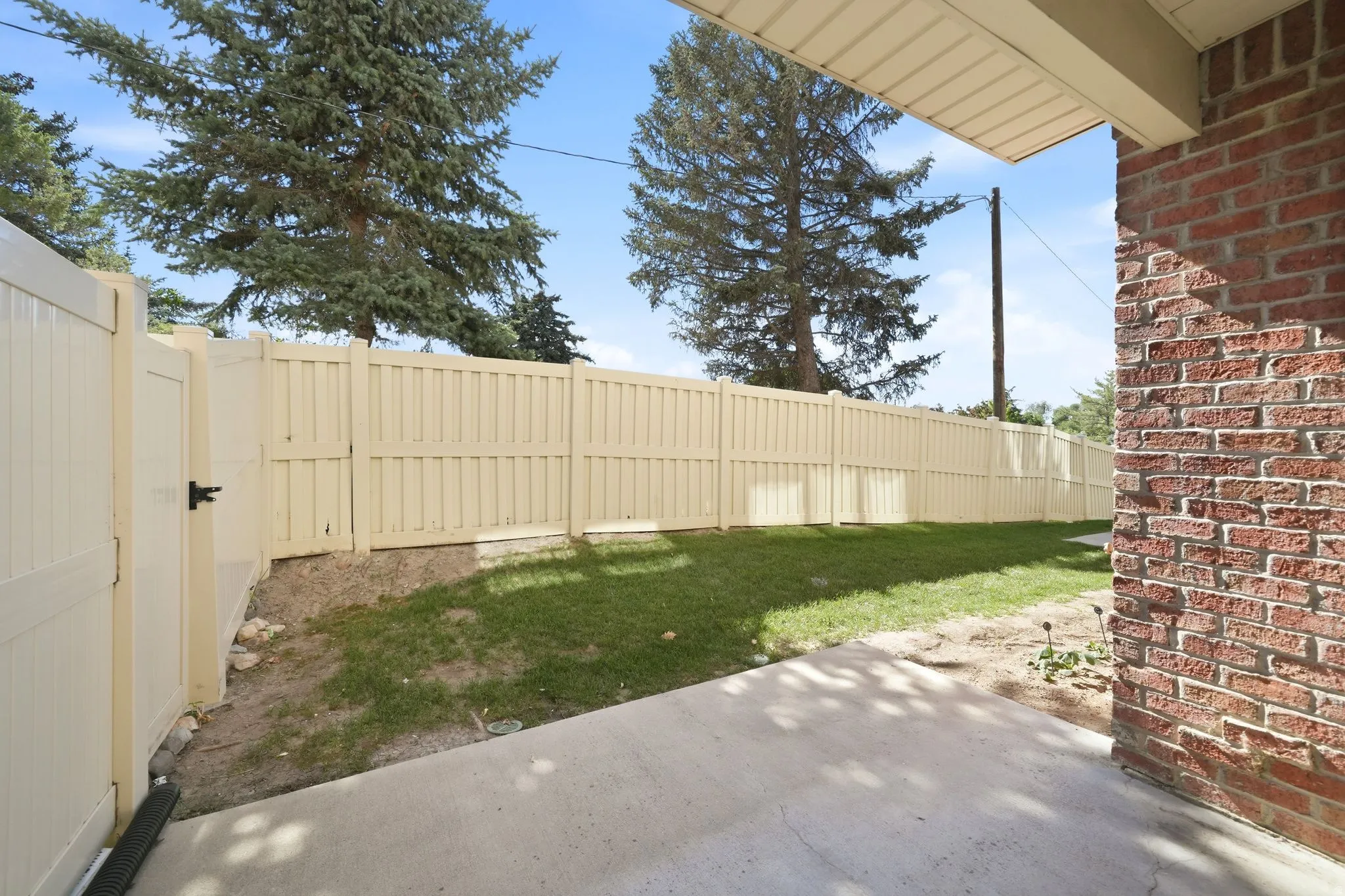 Fenced yard with a concrete patio