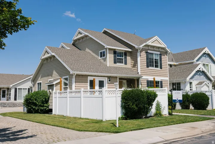 Contemporary two-story residence featuring composite shingle roofing and horizontal siding