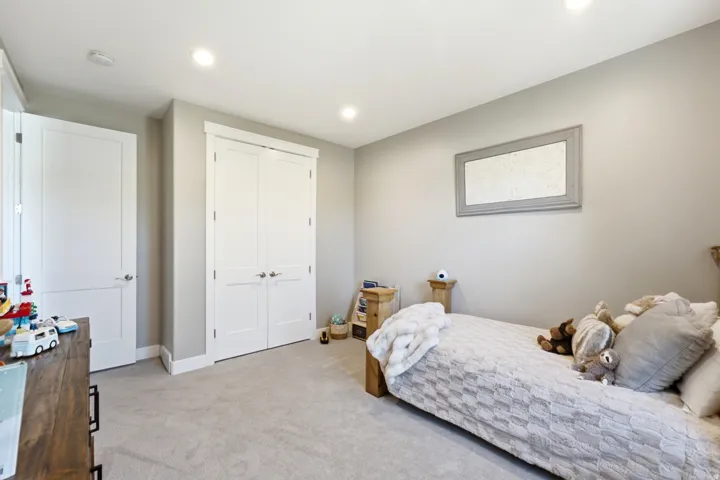 Neutral wall paint and plush carpet flooring create a serene atmosphere