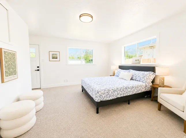 Bright interior featuring carpet flooring and white walls