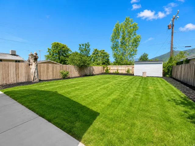 Spacious backyard featuring a substantial lawn area