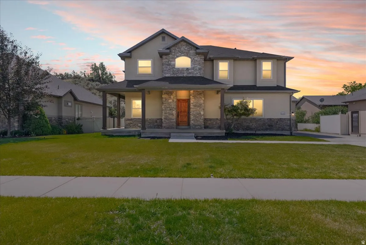 Stately two-story residence with a stone and stucco exterior