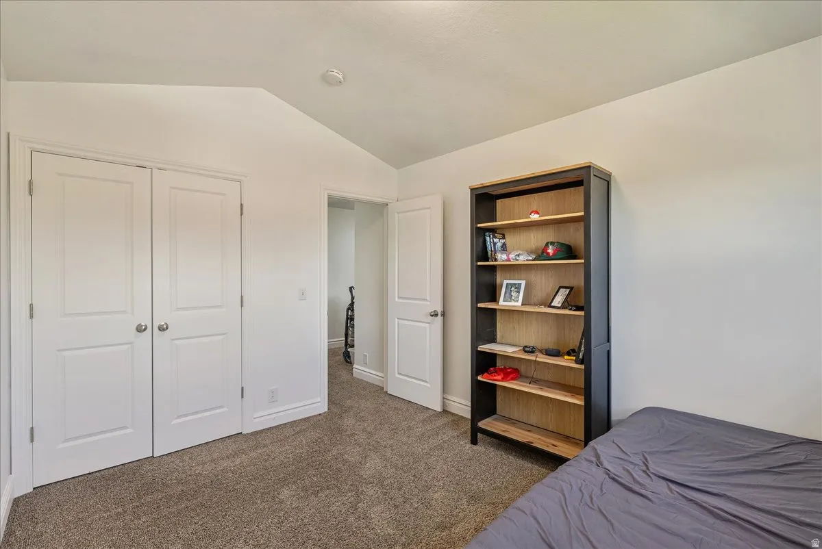 Neutral tone walls with textured carpet flooring