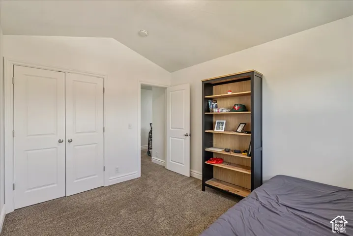 Neutral tone walls with textured carpet flooring