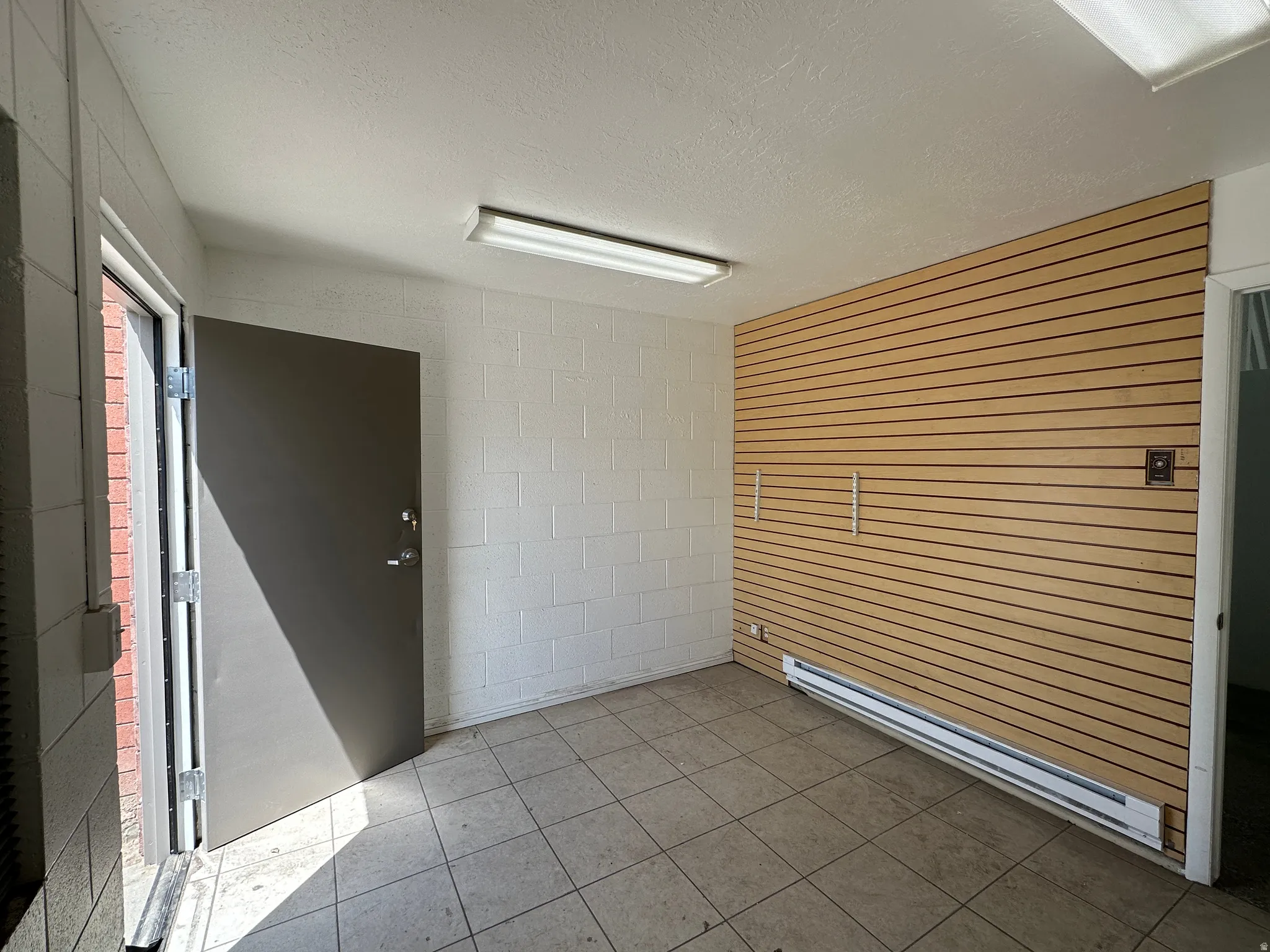 Tiled flooring throughout this versatile interior space