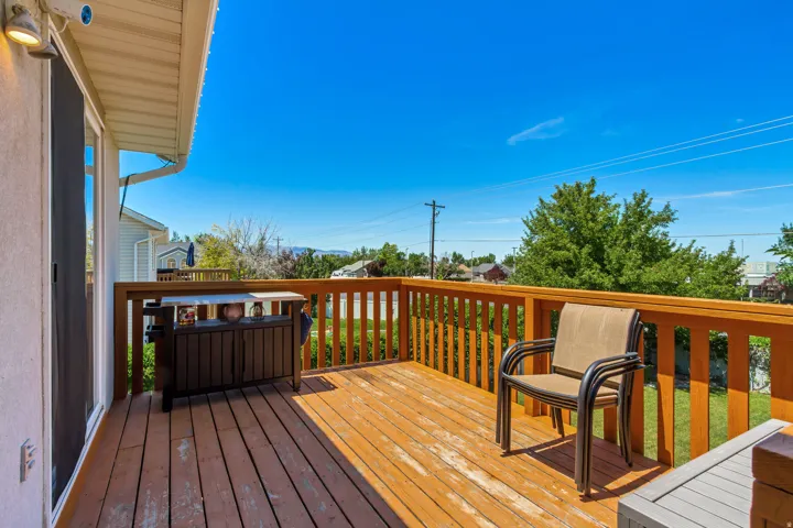 Expansive wood deck with a full-height railing