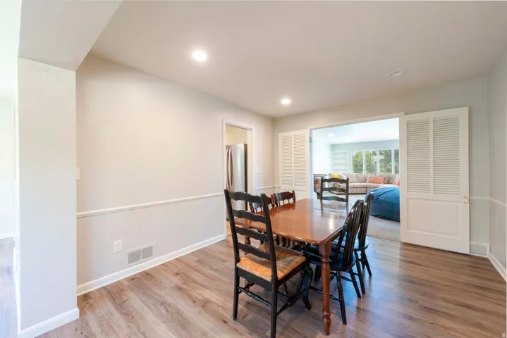 Dining area featuring newer flooring and recessed lighting