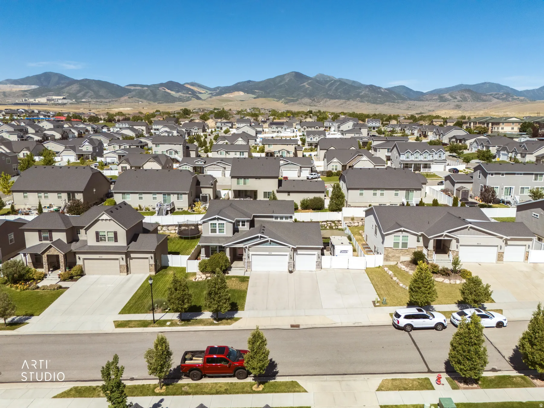 Residential neighborhood featuring a variety of single-family homes with mountain backdrops