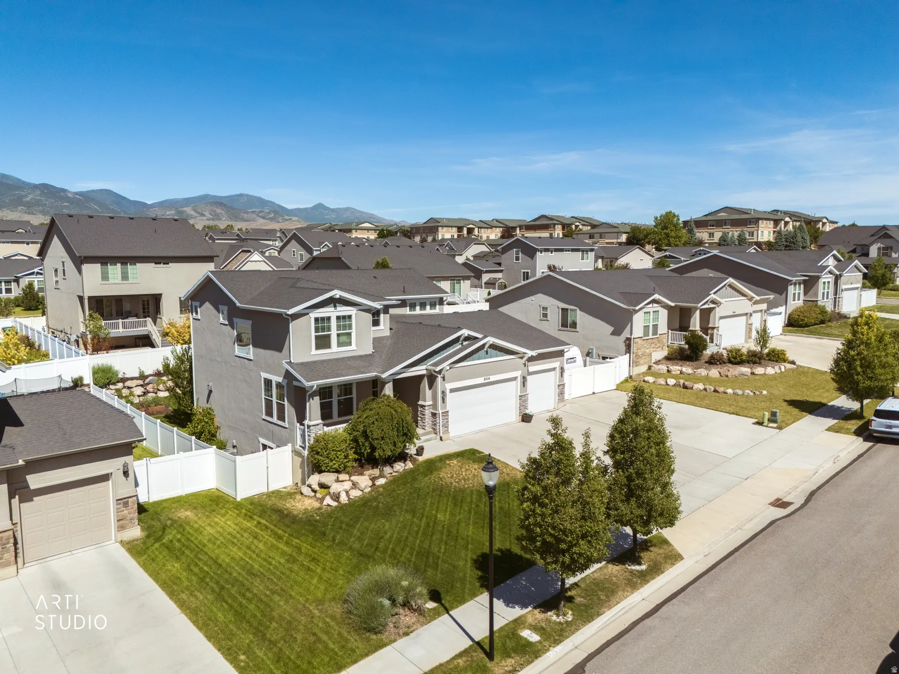 Residential street featuring a collection of properties with varied architectural styles