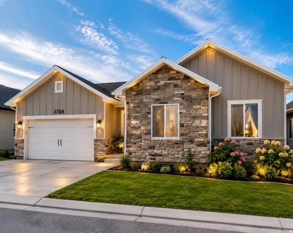 Stone and board-and-batten exterior with an attached two-car garage