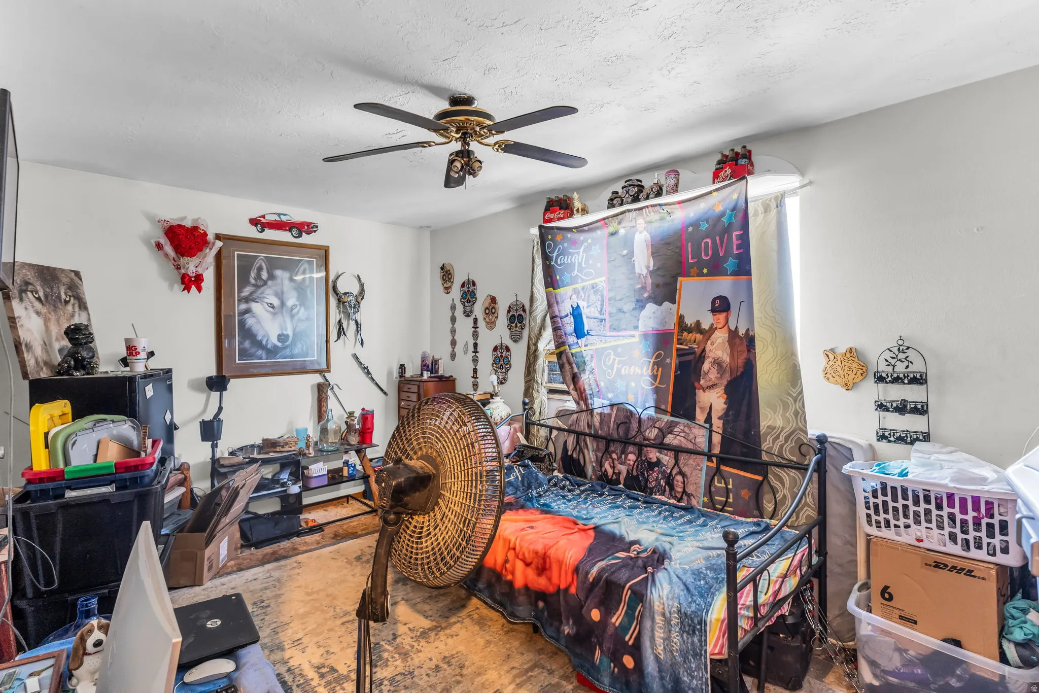 White walls with ceiling fan and a window