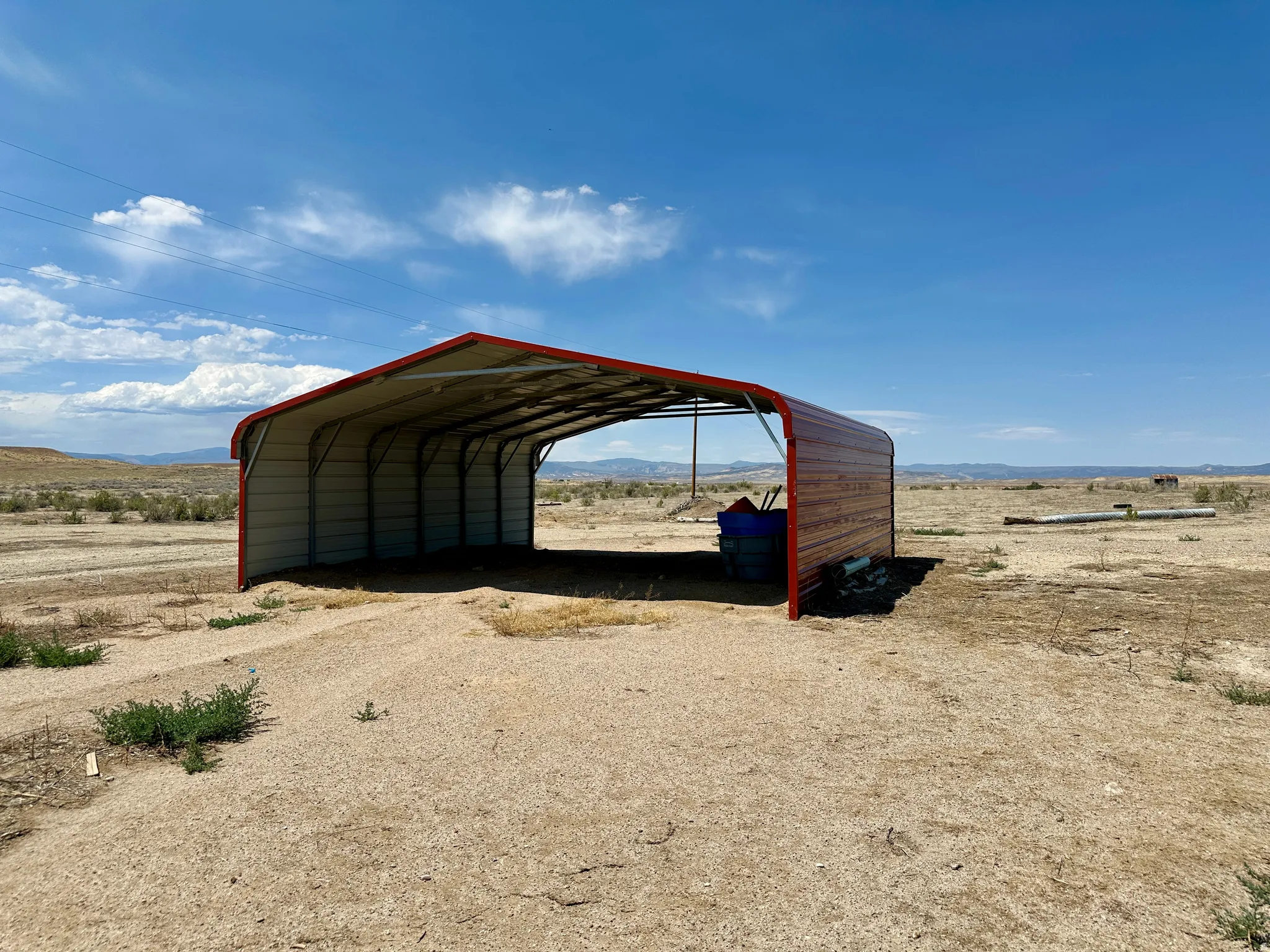 Open-sided metal carport