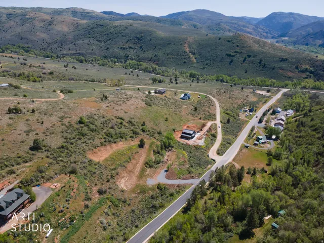Expansive mountainous landscape featuring natural vegetation and distant valleys
