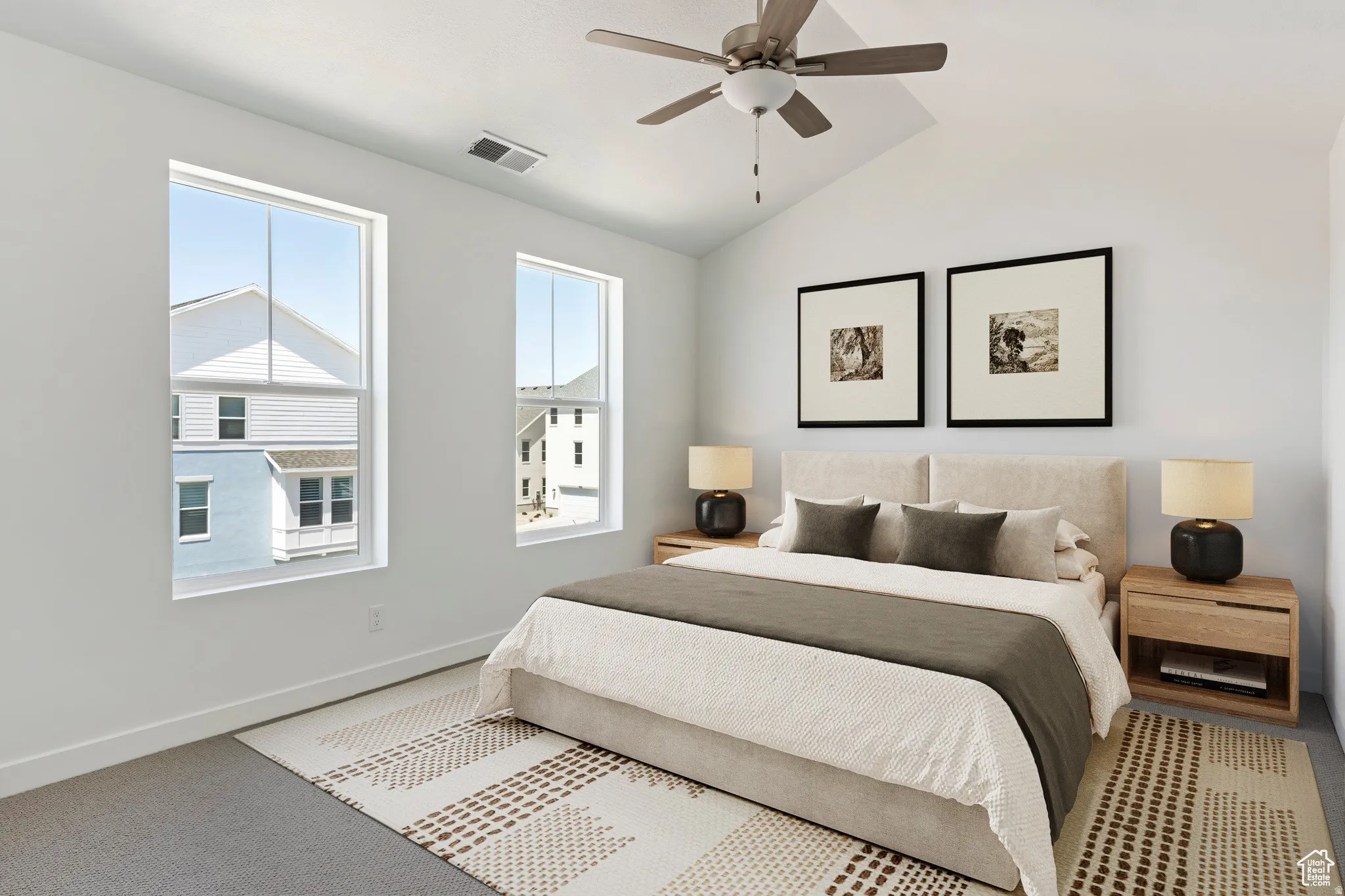 Bedroom featuring a vaulted ceiling and a ceiling fan