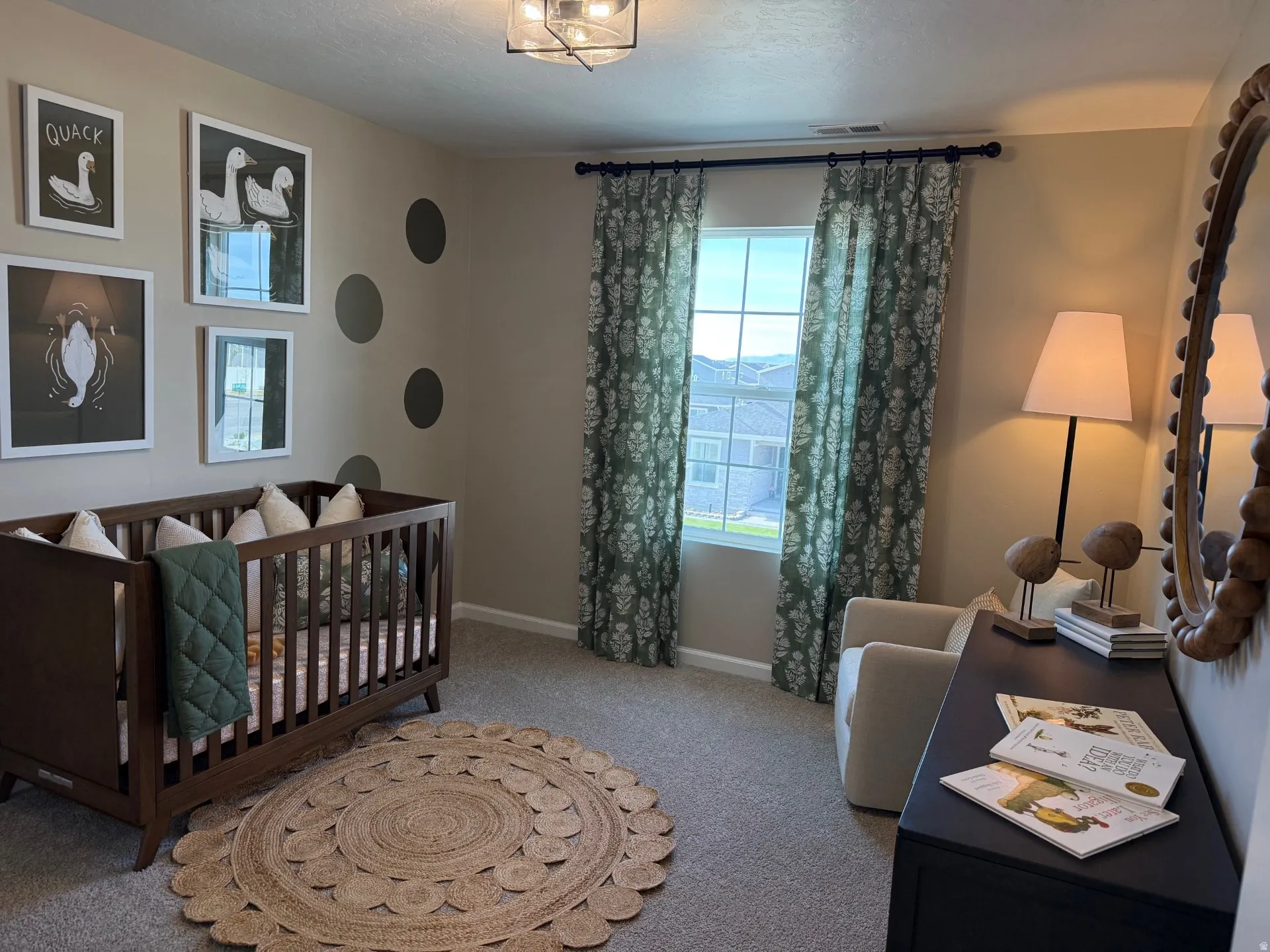 Carpeted room featuring a single window with patterned drapes, a flush mount ceiling light fixture, and neutral wall paint