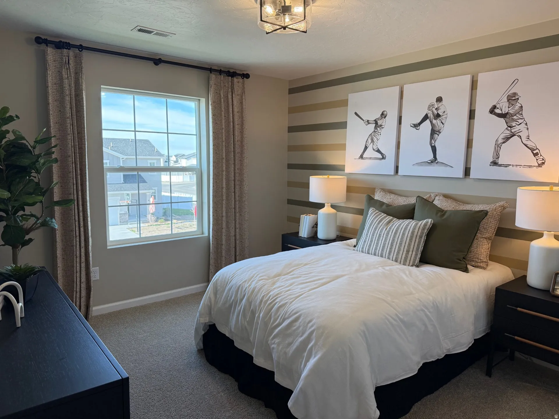 Bedroom featuring carpet flooring and a multi-pane window