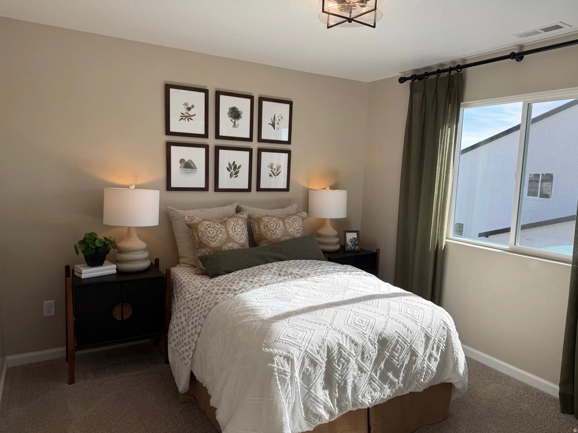 Neutral-toned walls complement plush carpet flooring