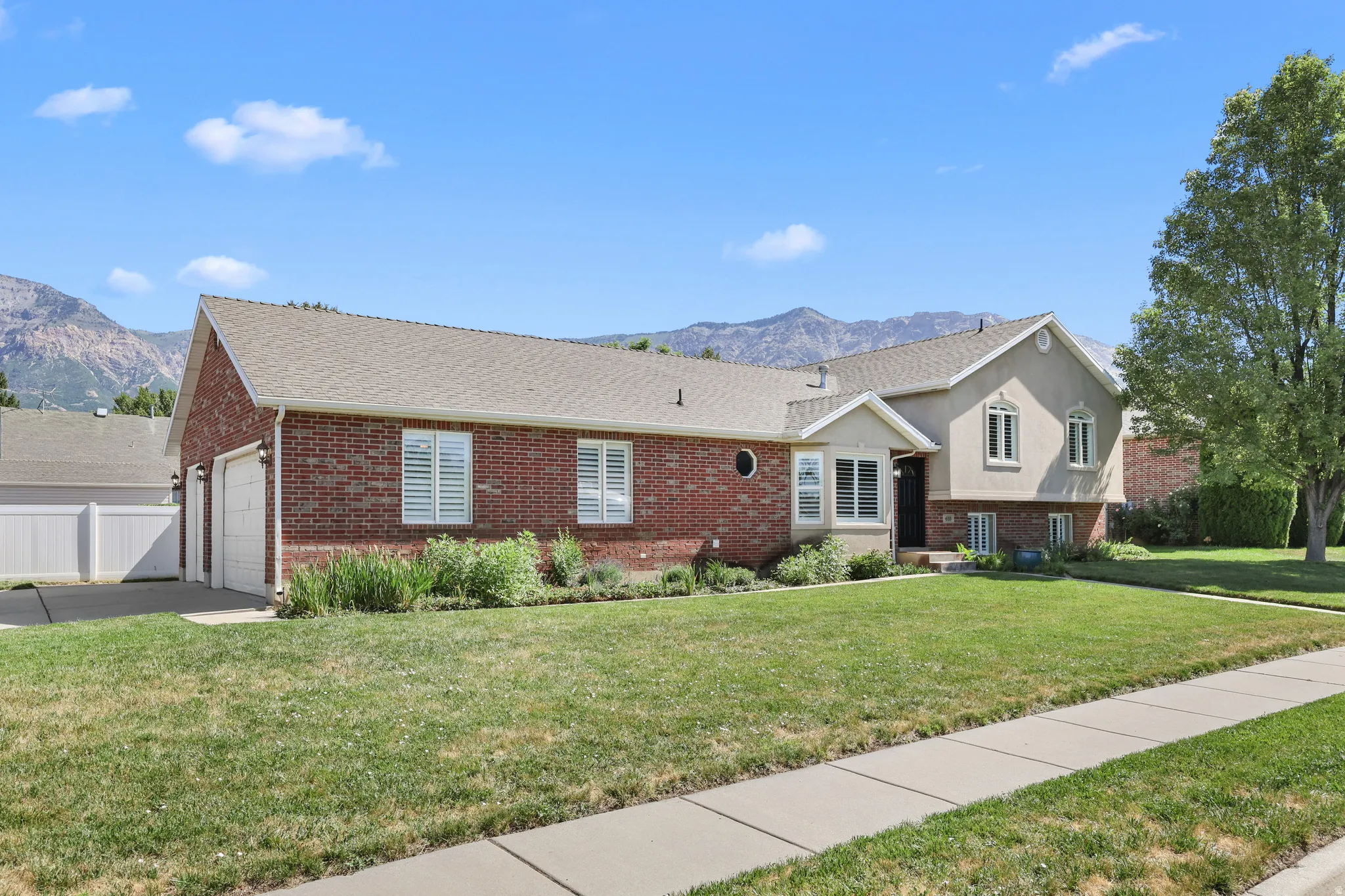 Brick and stucco exterior with a two-car garage