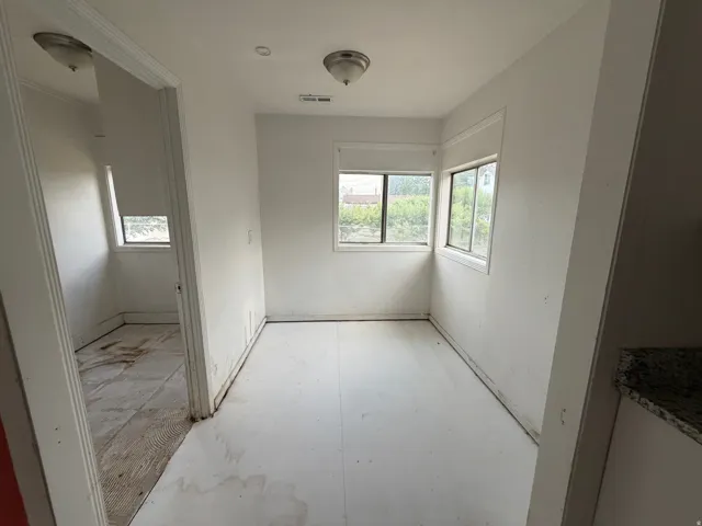 Well-lit interior space featuring multiple windows