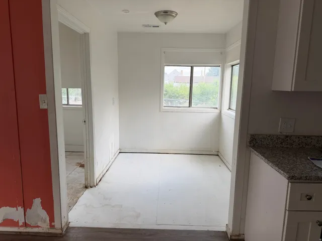 Corner room with multiple windows providing natural light