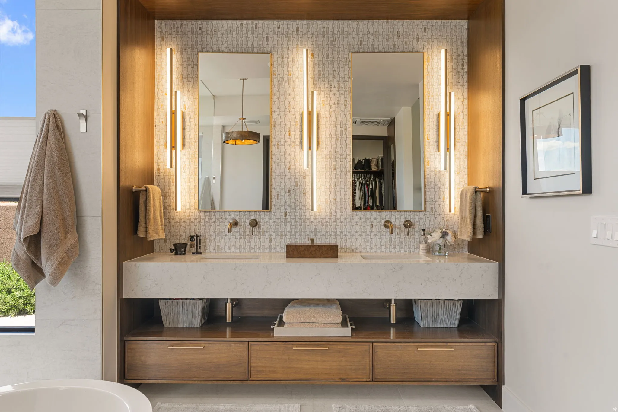 Dual floating vanity with integrated rectangular sinks and stone-finish countertop