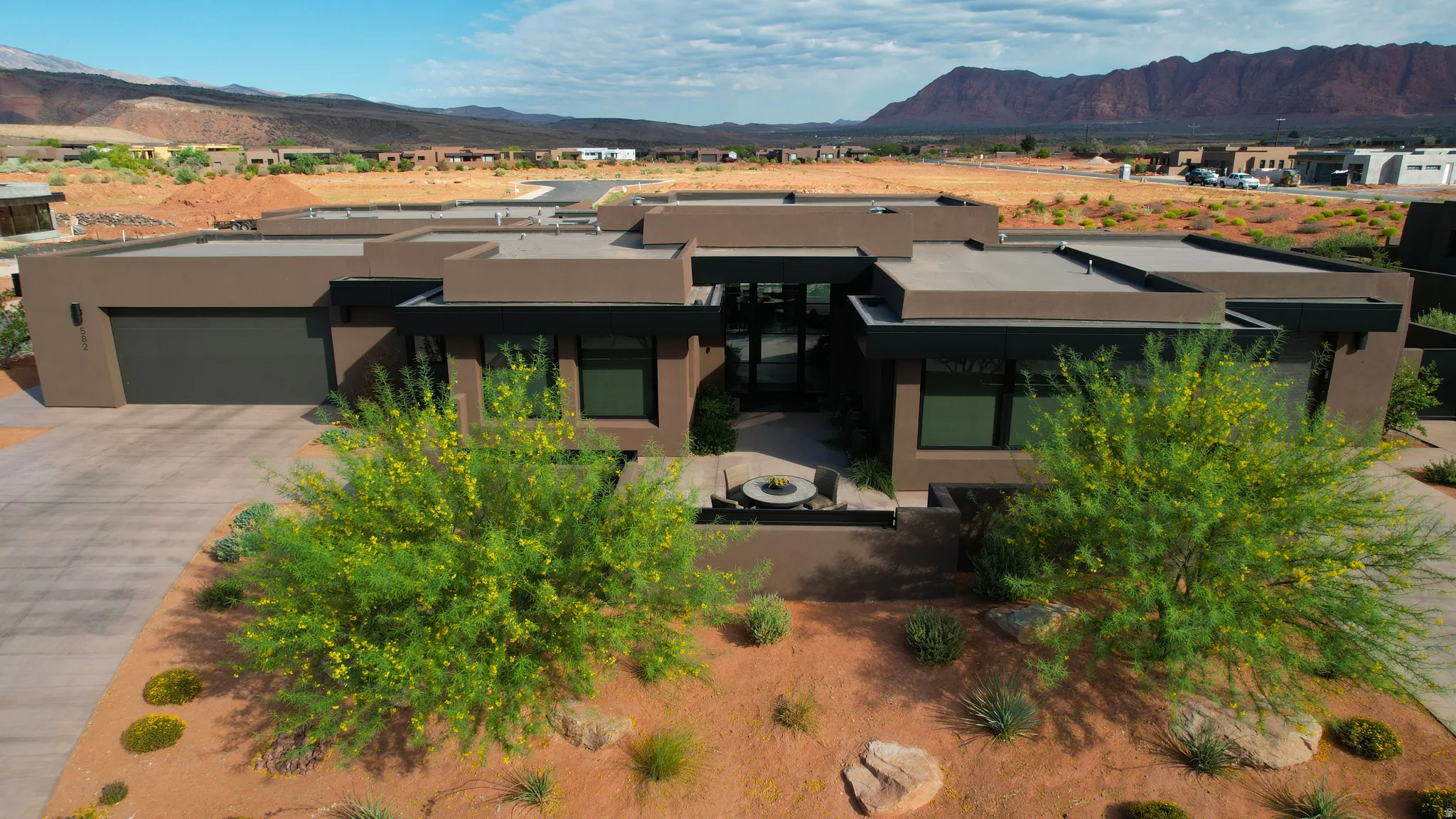Contemporary architecture featuring a low-slope roofline and a neutral-toned exterior