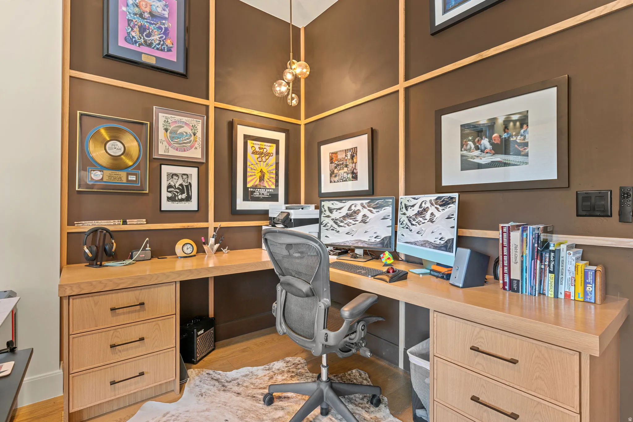 Custom built-in wood desk with integrated drawers and contemporary hardware