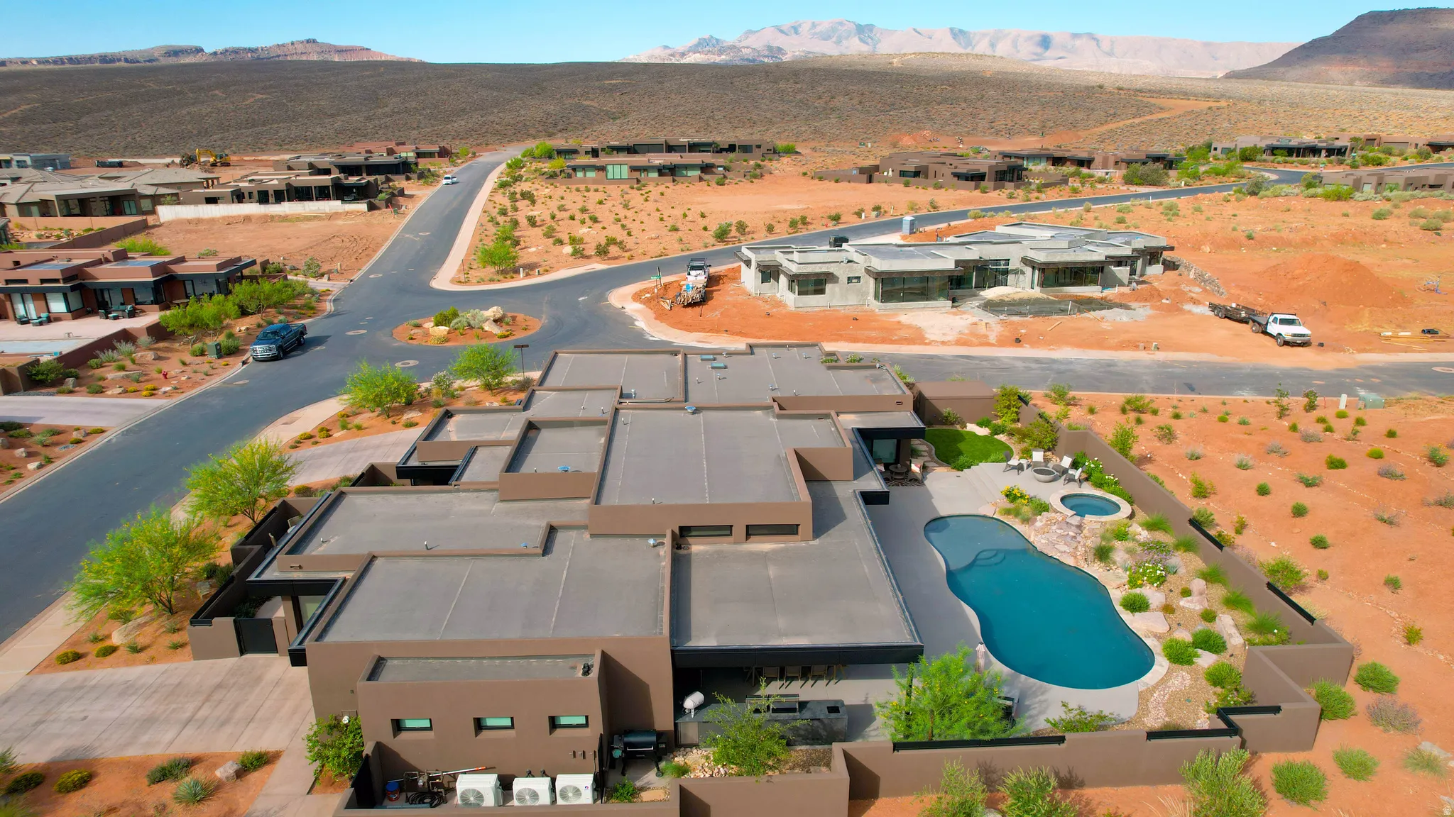 Contemporary desert architecture with a flat roofline and dark exterior finish