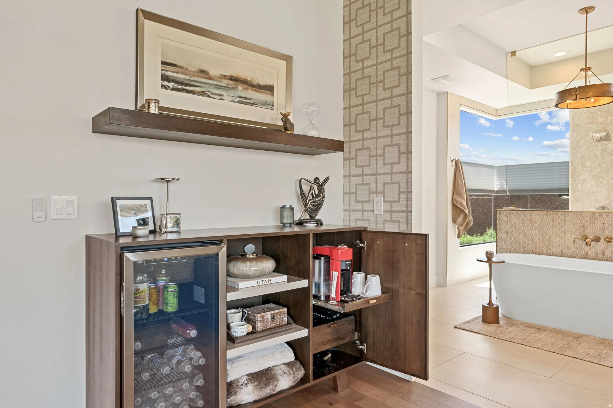 Owner's Suite with custom built-in cabinet featuring an Integrated beverage cooler within hidden coffee/Bev station
