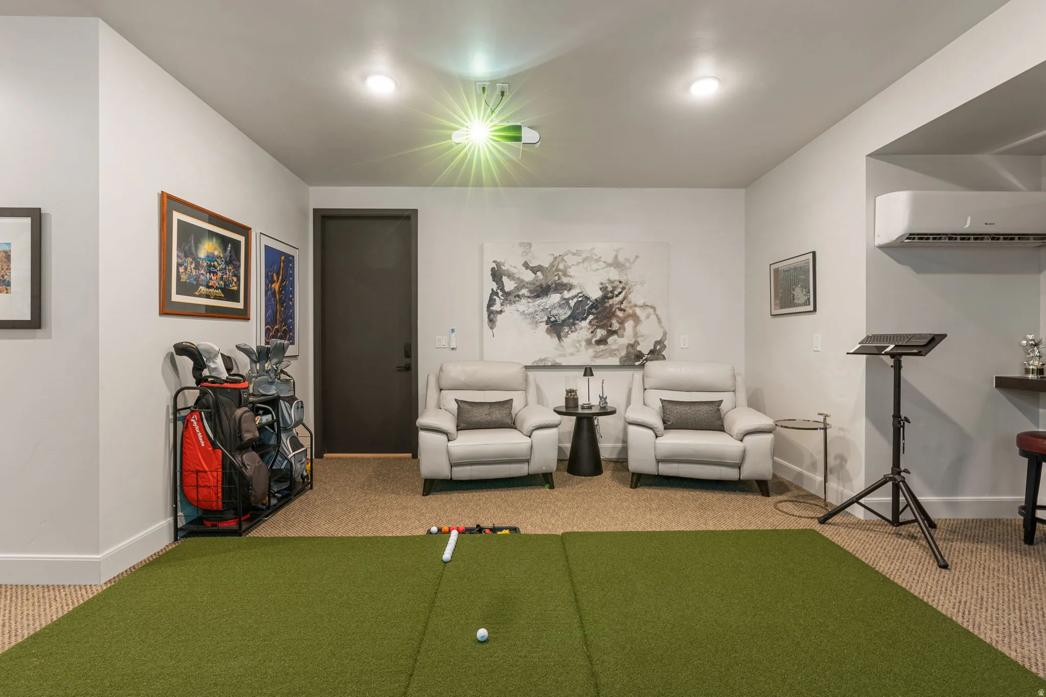 Golf simulator area with viewing area