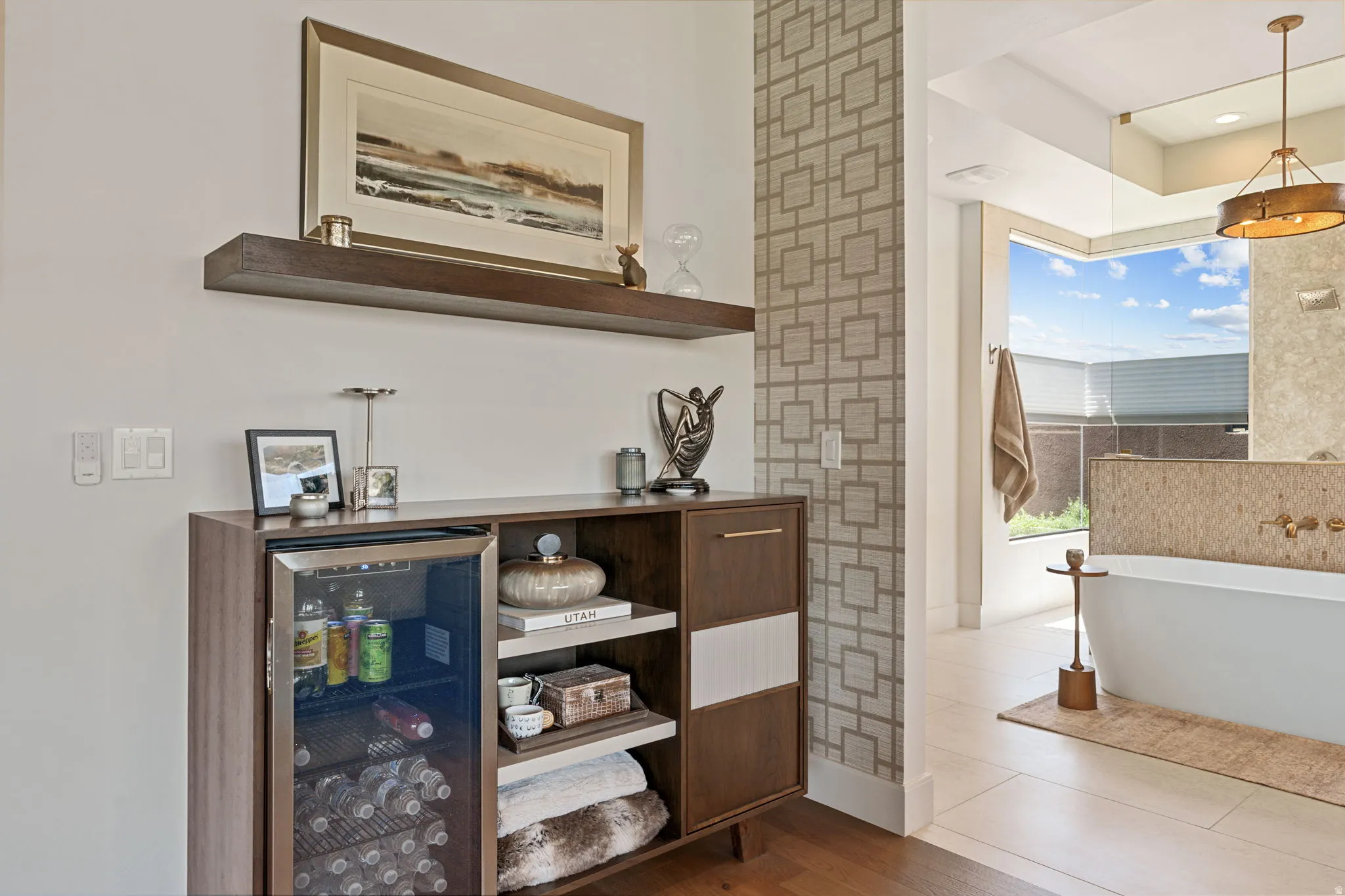 Owner's Suite with custom built-in cabinet featuring an Integrated beverage cooler within hidden coffee/Bev station