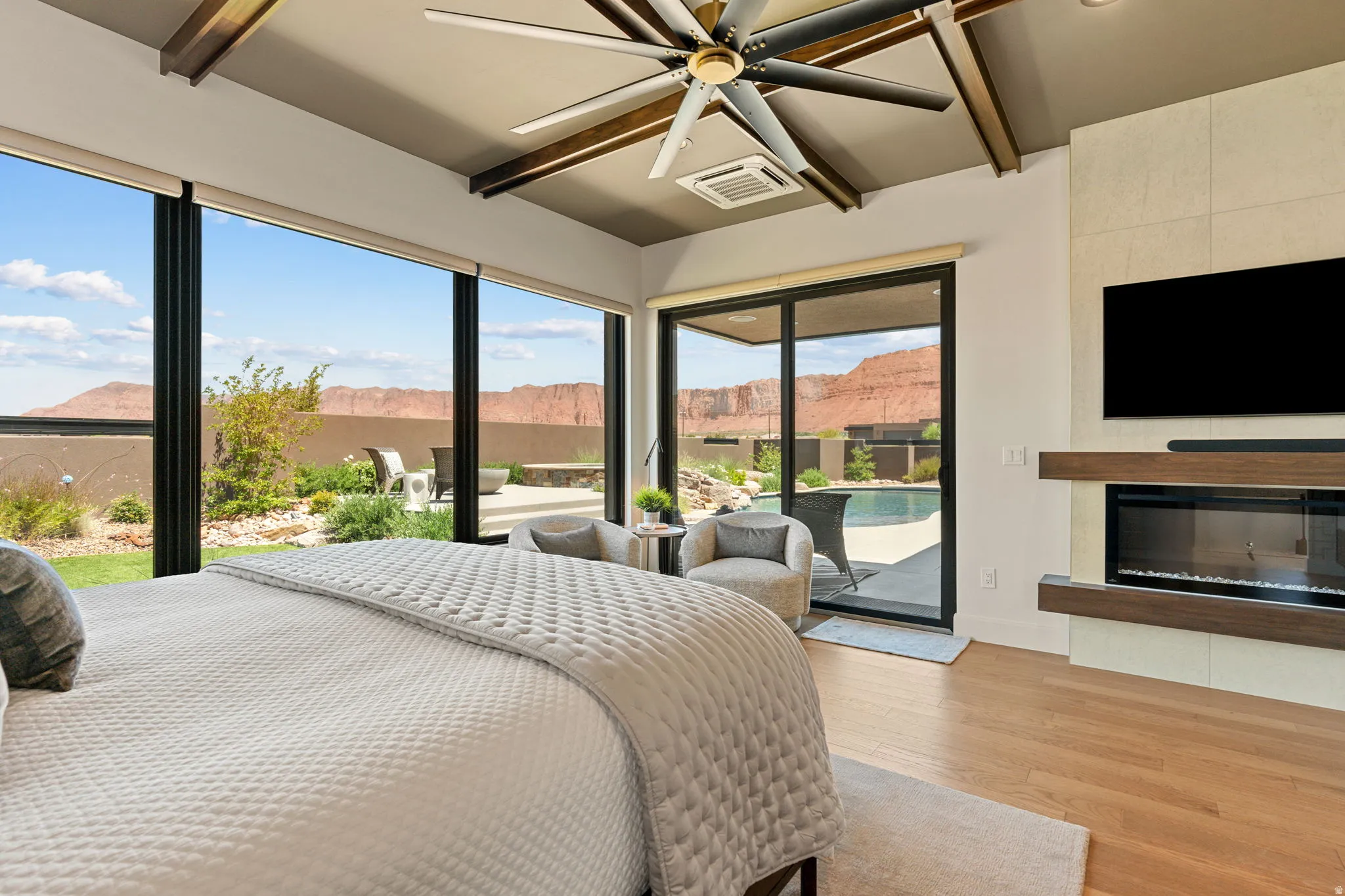 Owner's Suite with expansive windows and view of red rock mountain