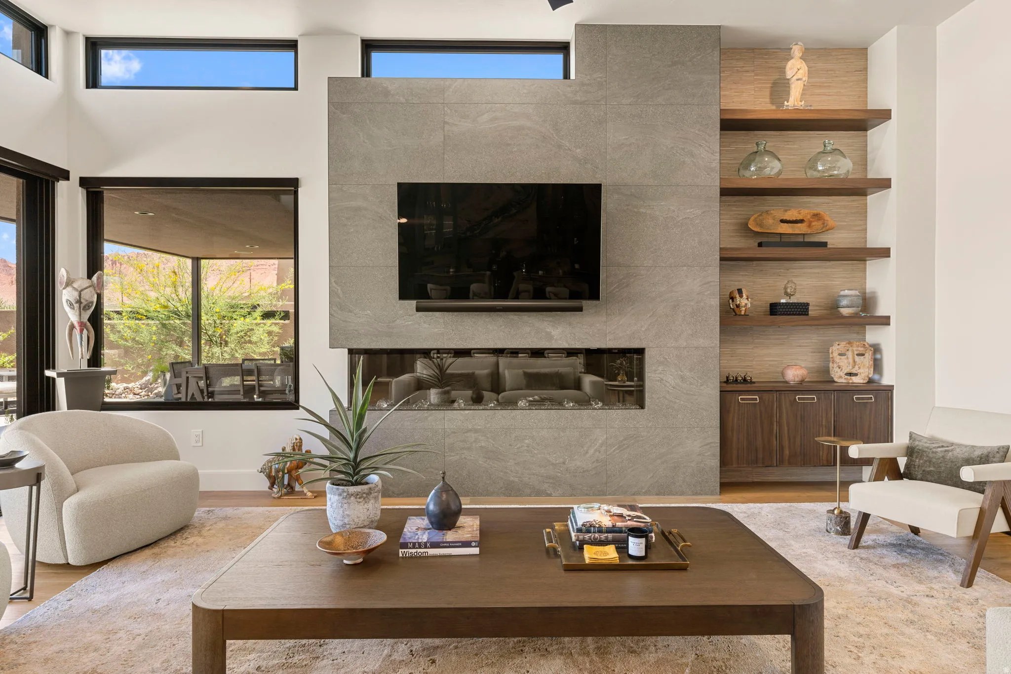 Contemporary living area featuring a tile fireplace with an integrated linear firebox