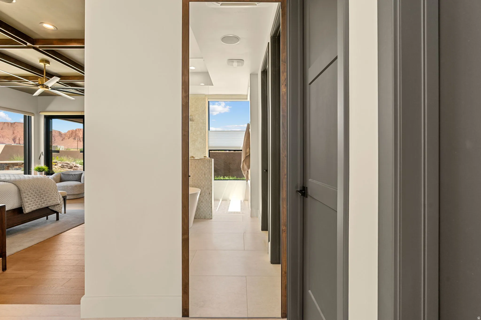 Owner's Suite bathroom with hidden closet behind full length mirror