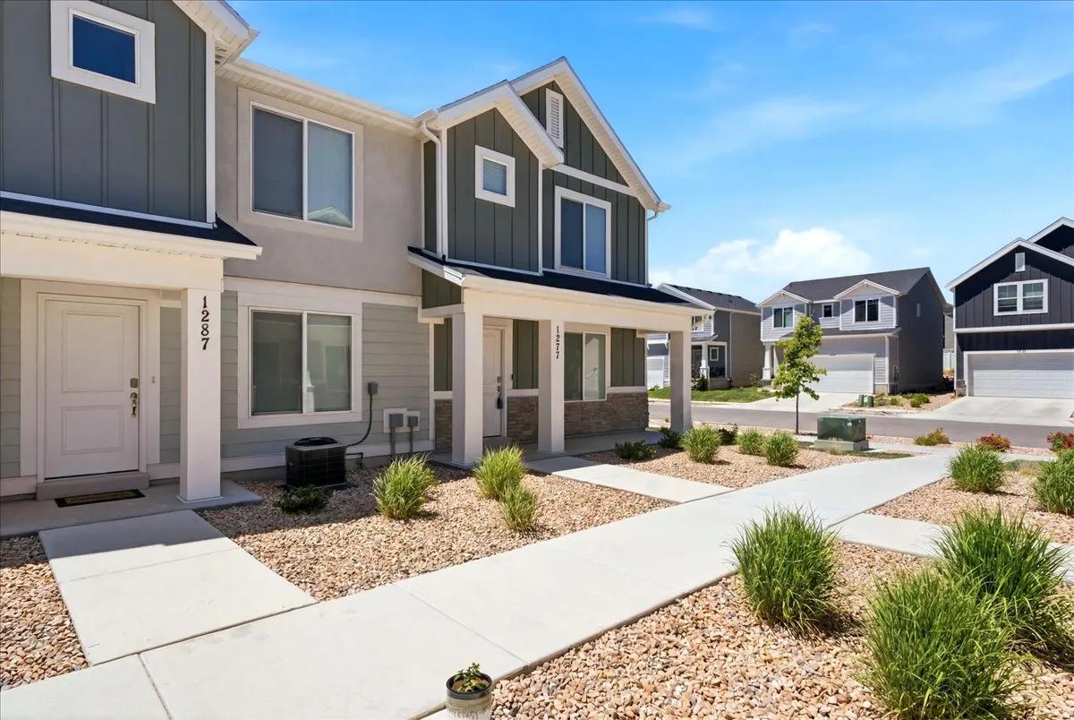Front viewstone accents, and a concrete walkway