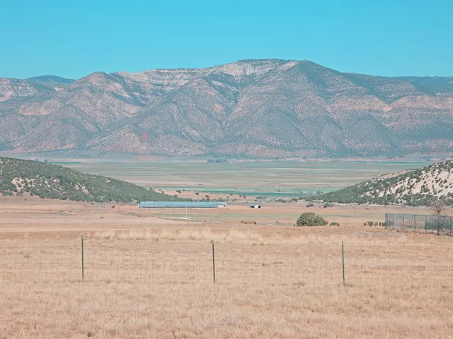 Expansive mountainous terrain surrounding a vast valley