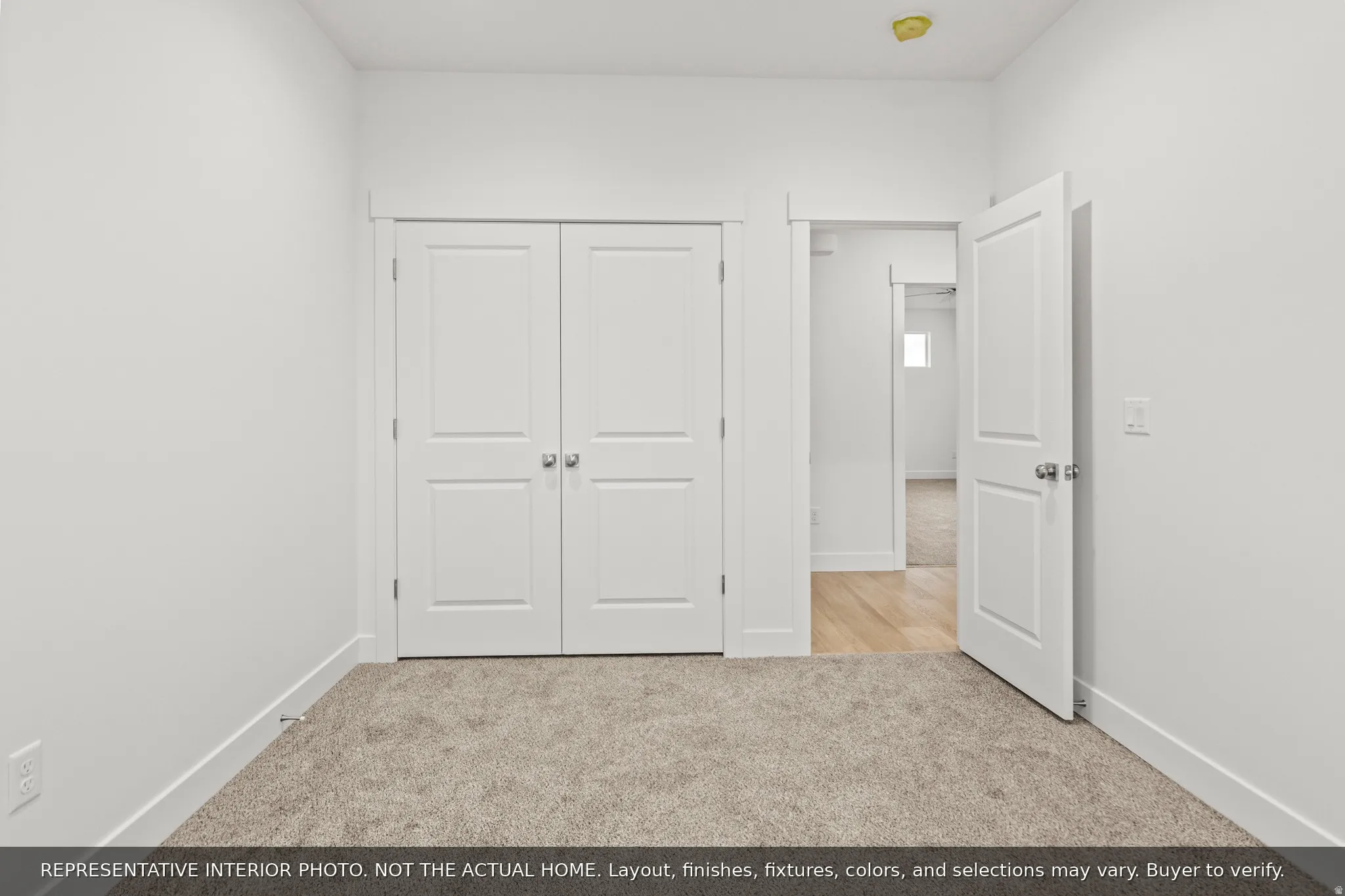 Neutral-toned carpeting paired with white walls