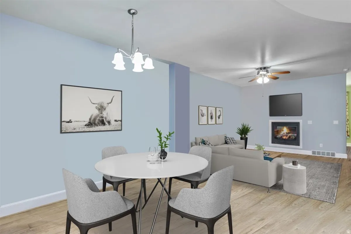 Open concept living space with light wood-finish flooring