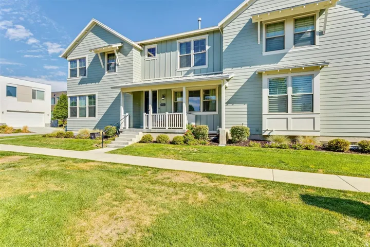 Light blue siding exterior featuring multiple window styles