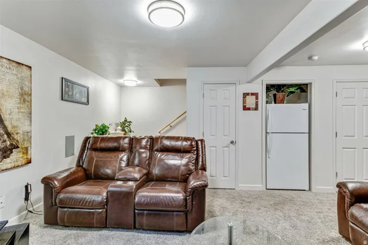 Carpeted living area featuring recessed lighting