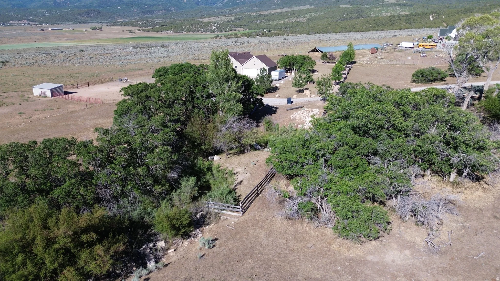 Property with extensive land, mature trees, and private access to mountain stream.