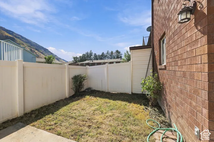 Private Backyard, fenced yard with a brick exterior