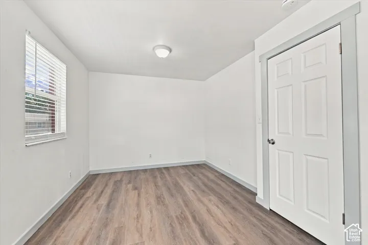 Master Bedroom. Wood-finish flooring with white walls and trim