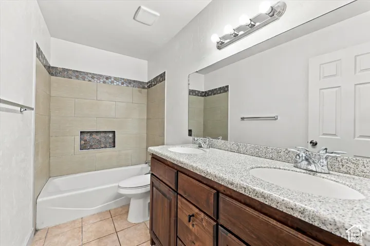 Full Bathroom. Dual vanity with granite-finish countertop