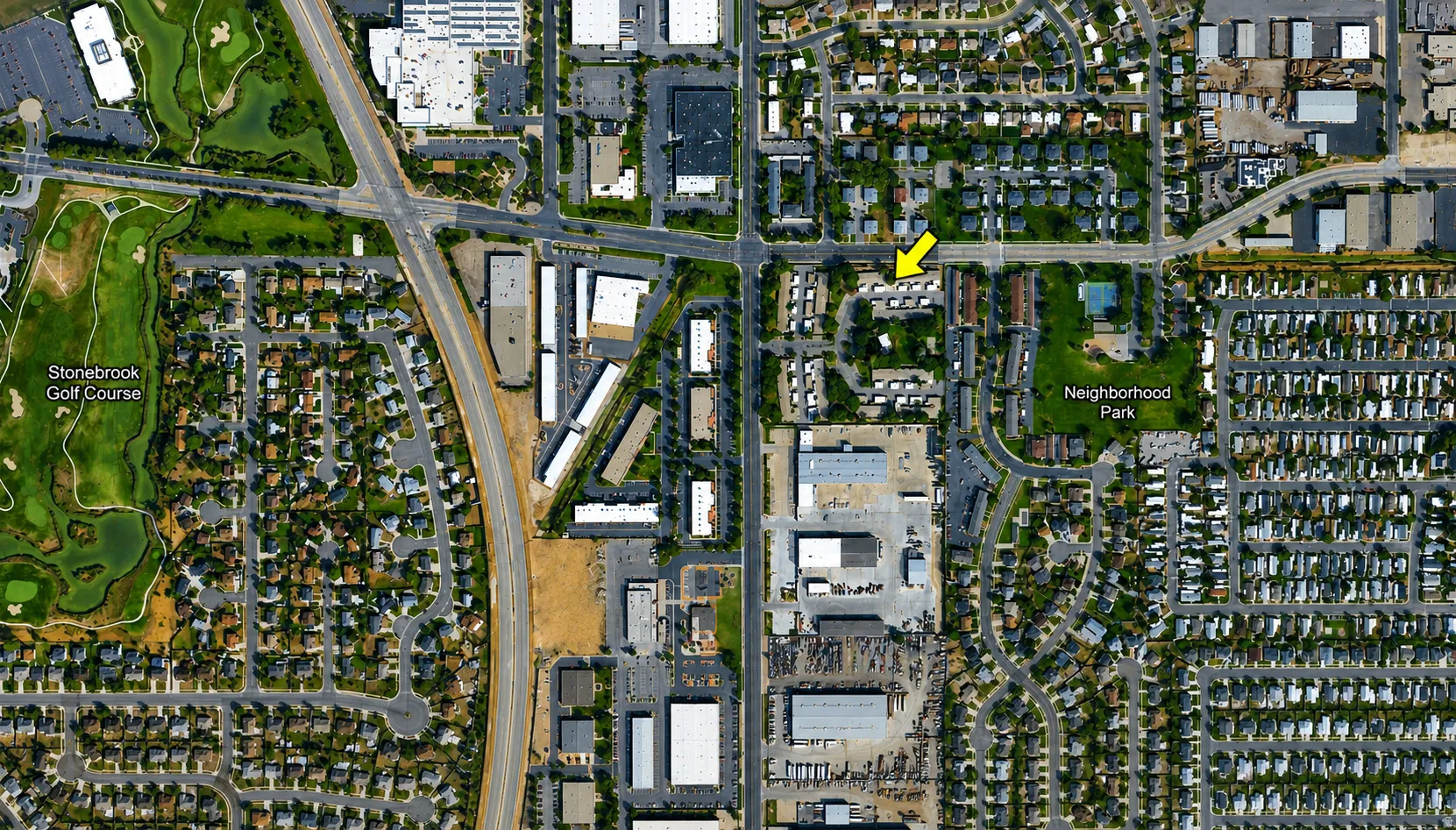 Aerial Map. Depicting the property's location and surrounding infrastructure, including residential areas, commercial properties, and a golf course