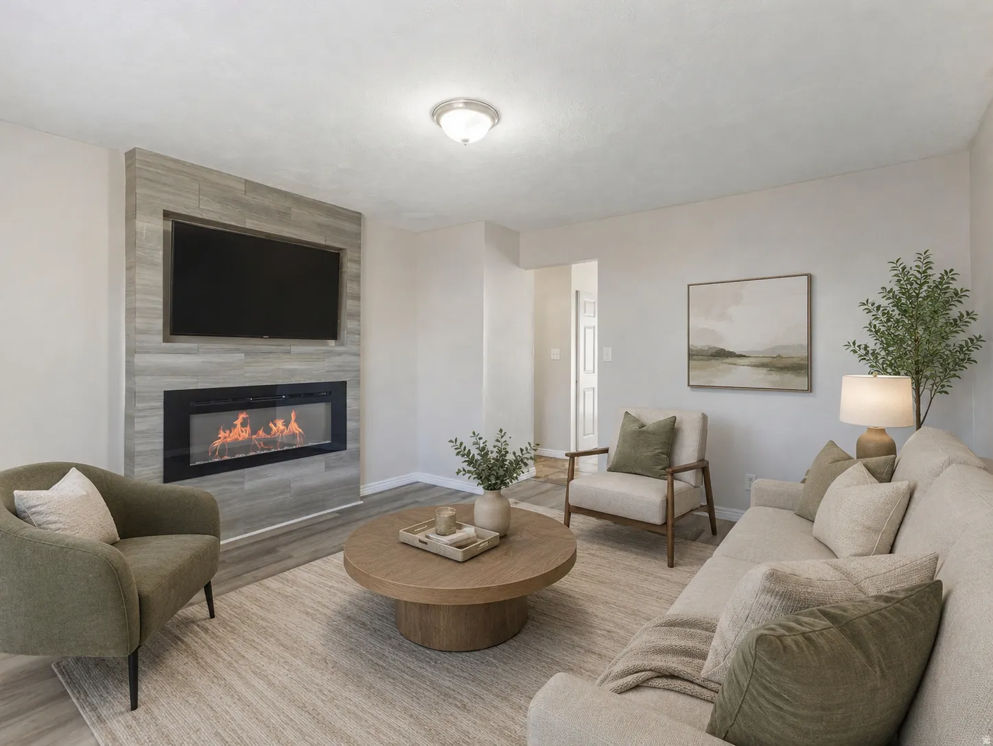 Living area featuring a modern fireplace with a linear firebox, set within a tiled accent wall