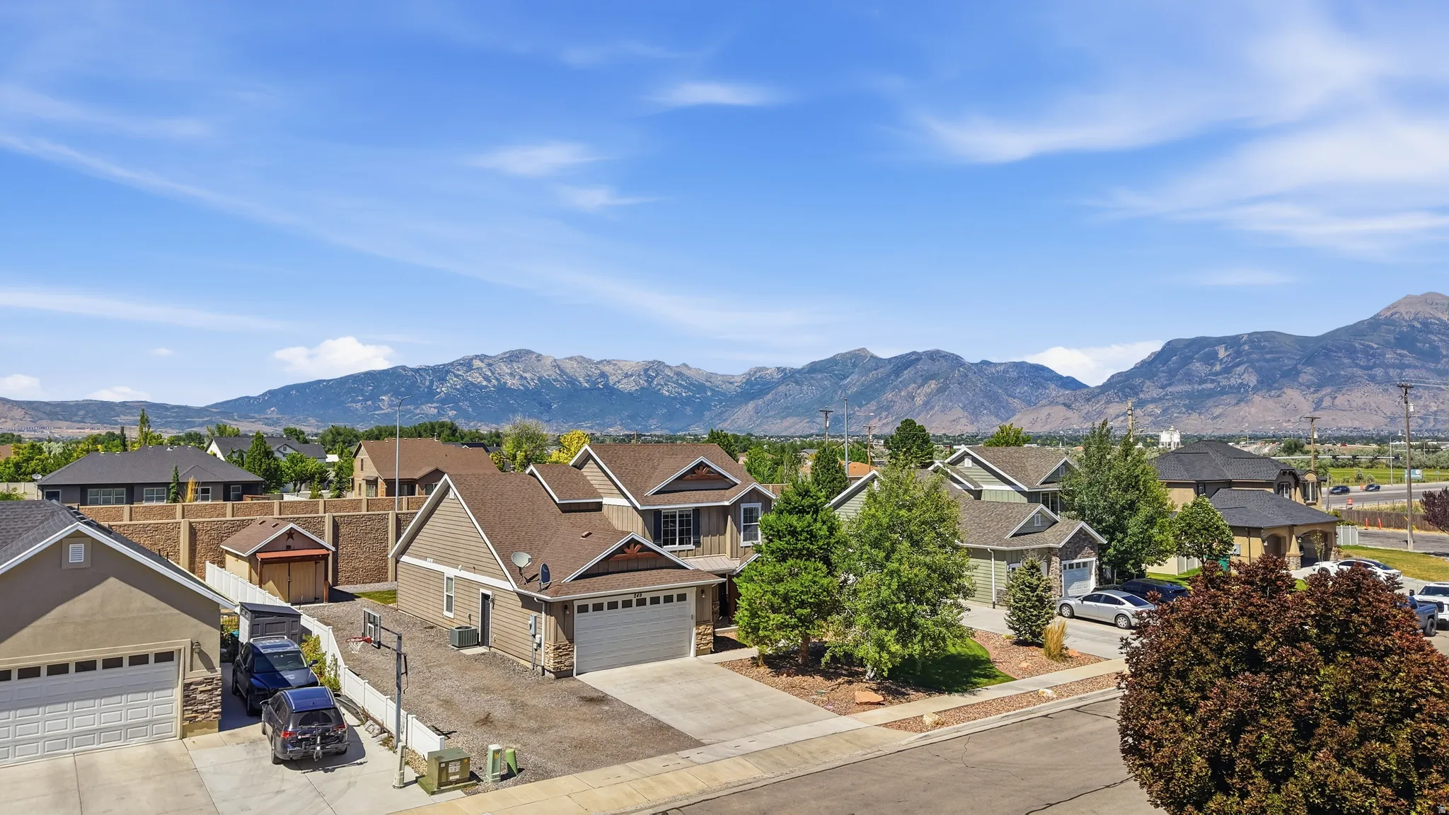 Clean residential neighborhood featuring a variety of single-family homes with mountain backdrops