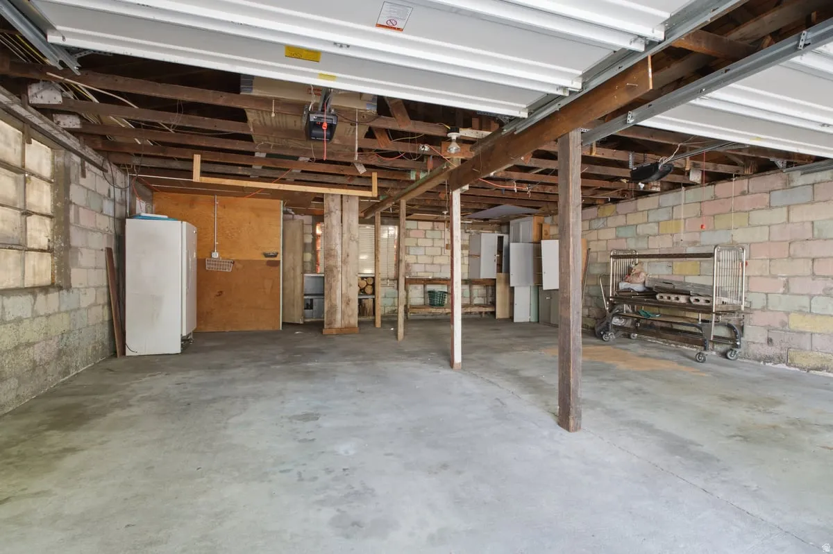extra large- deep- detached garage. Concrete slab flooring and exposed ceiling beams