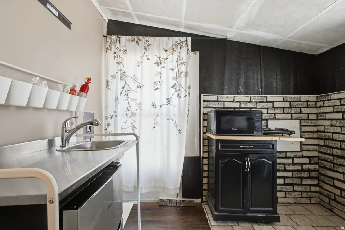 ADU/kitchen/bedroom#3.  Owner used this space as extra income. Stainless steel counter with integrated sink