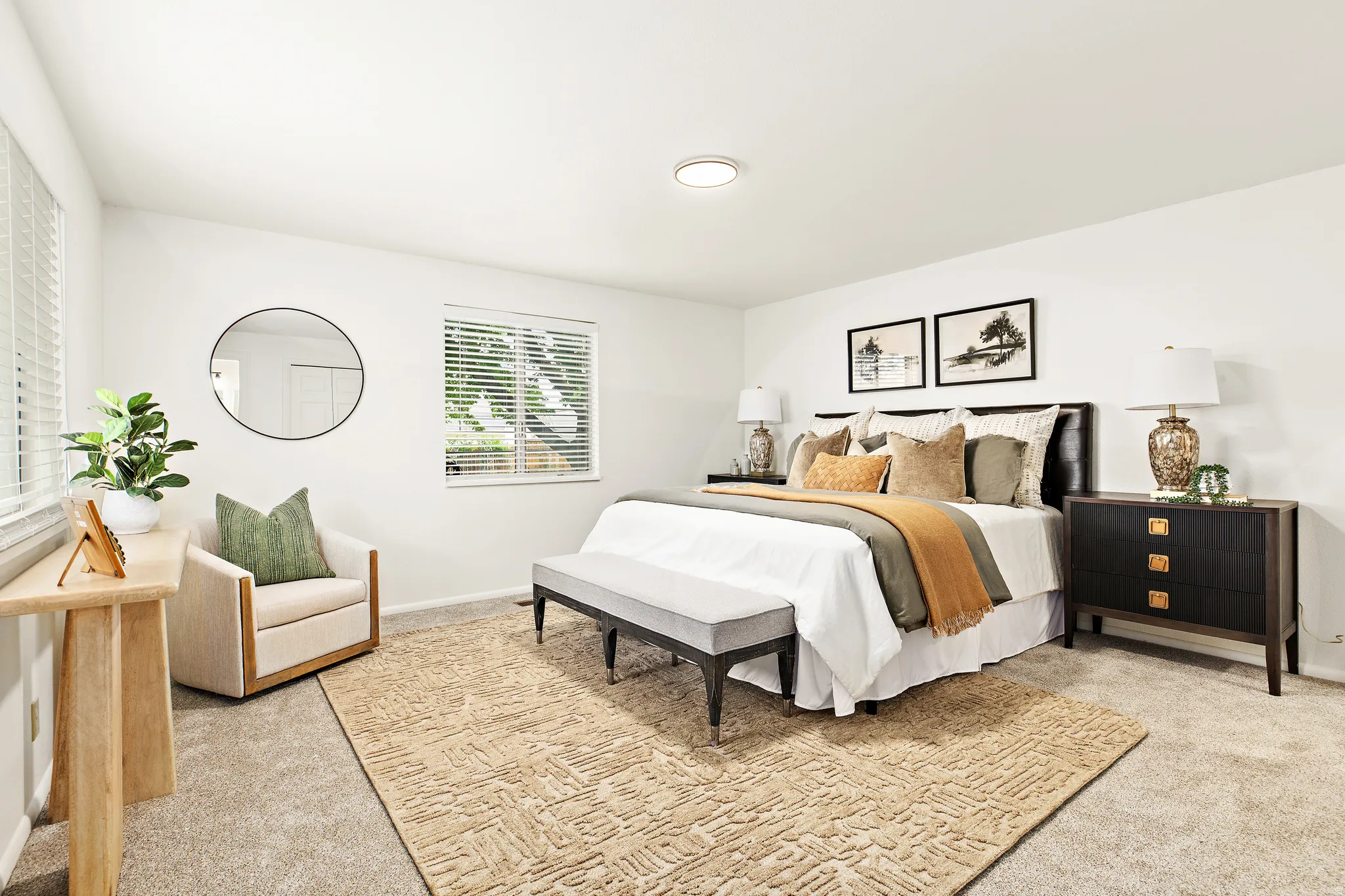 Carpeted bedroom featuring multiple windows with blinds, a built-in ceiling light, and white walls